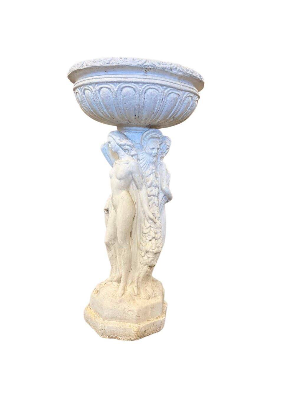 Vintage white concrete garden statue adorned with planter.