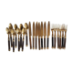 Set of old dessert cutlery in wood and brass