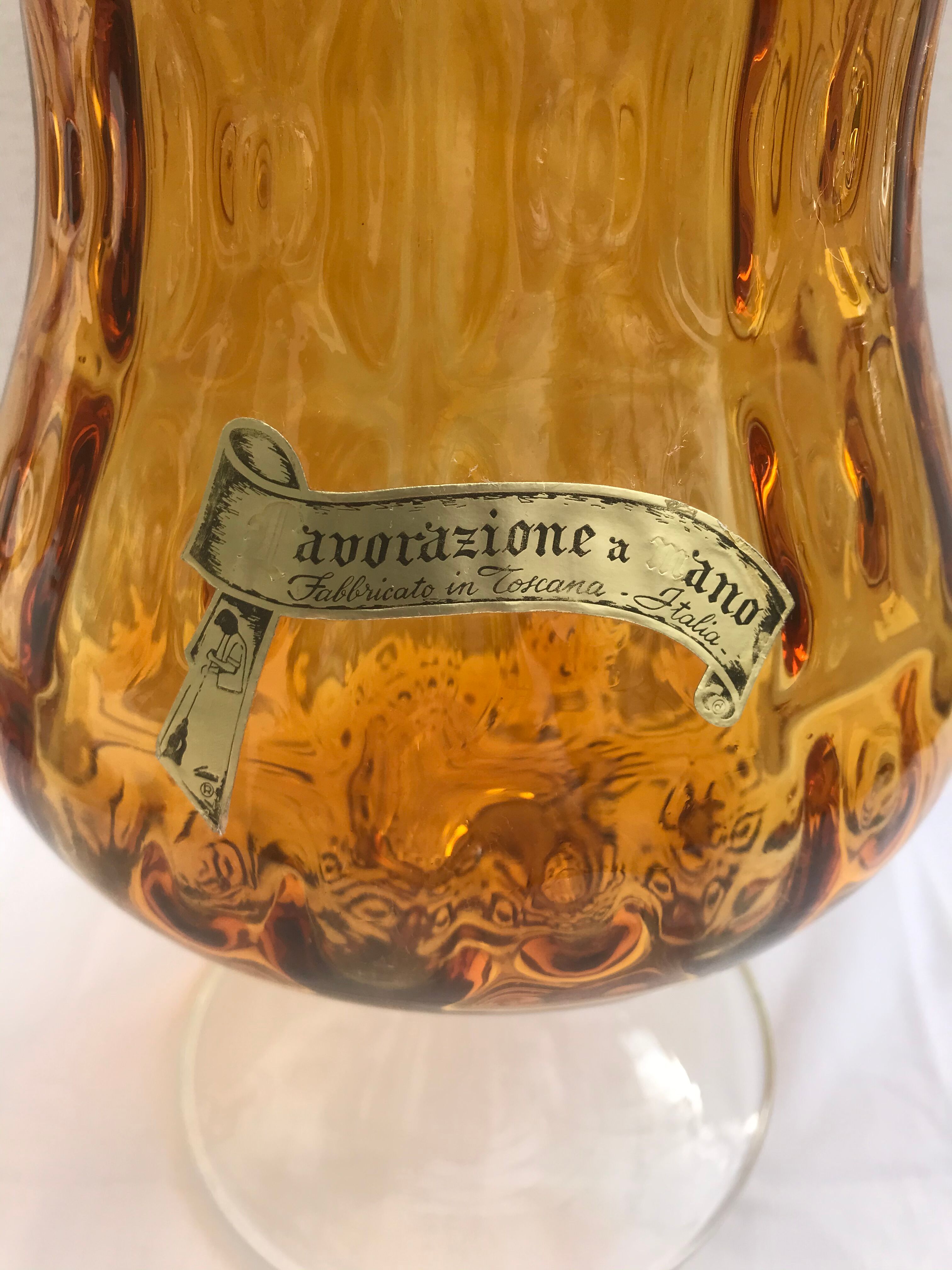 Ancient vase on foot orange glass