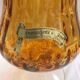 Ancient vase on foot orange glass