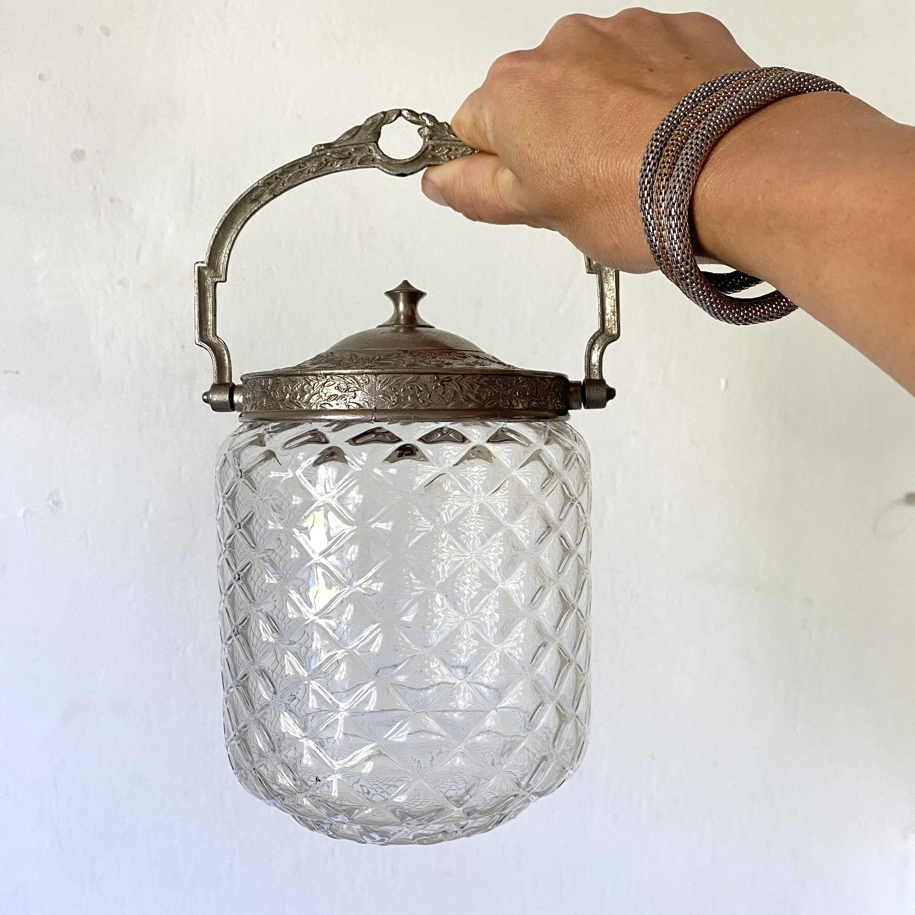 Old biscuit bucket in glass and metal