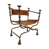 Curule leather armchair