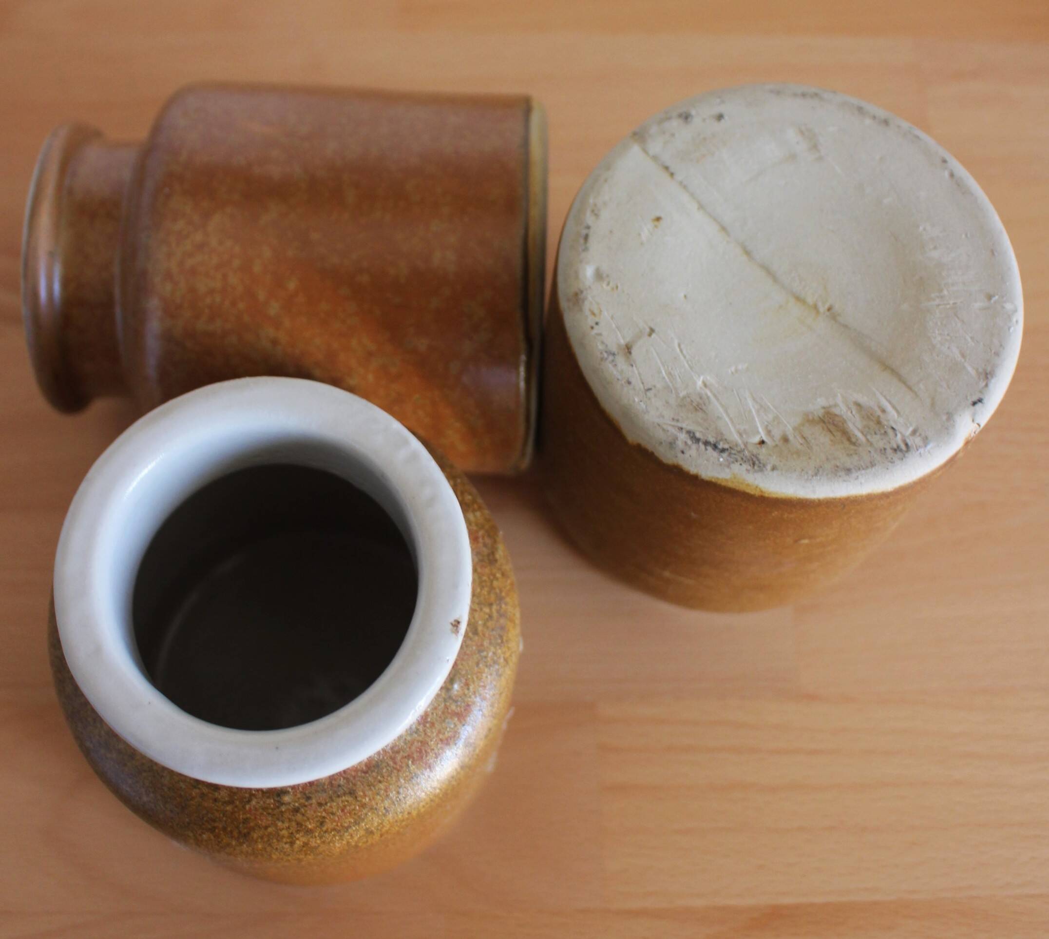 A set of 3 vintage glazed stoneware vases for indoor use.