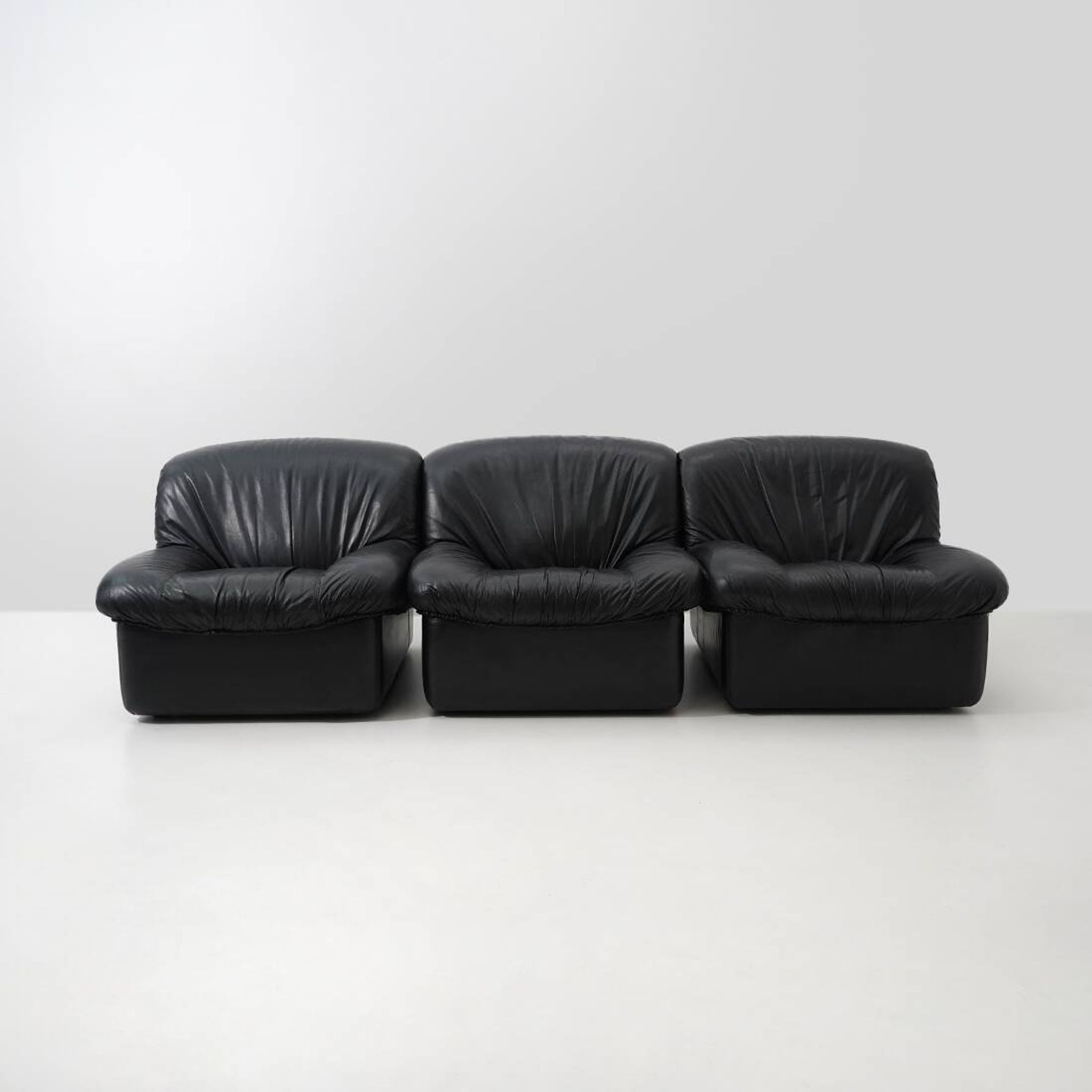 Modular black leather armchairs, 1970s