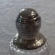 Crystal and solid silver shaker, neck brace and master's mark.