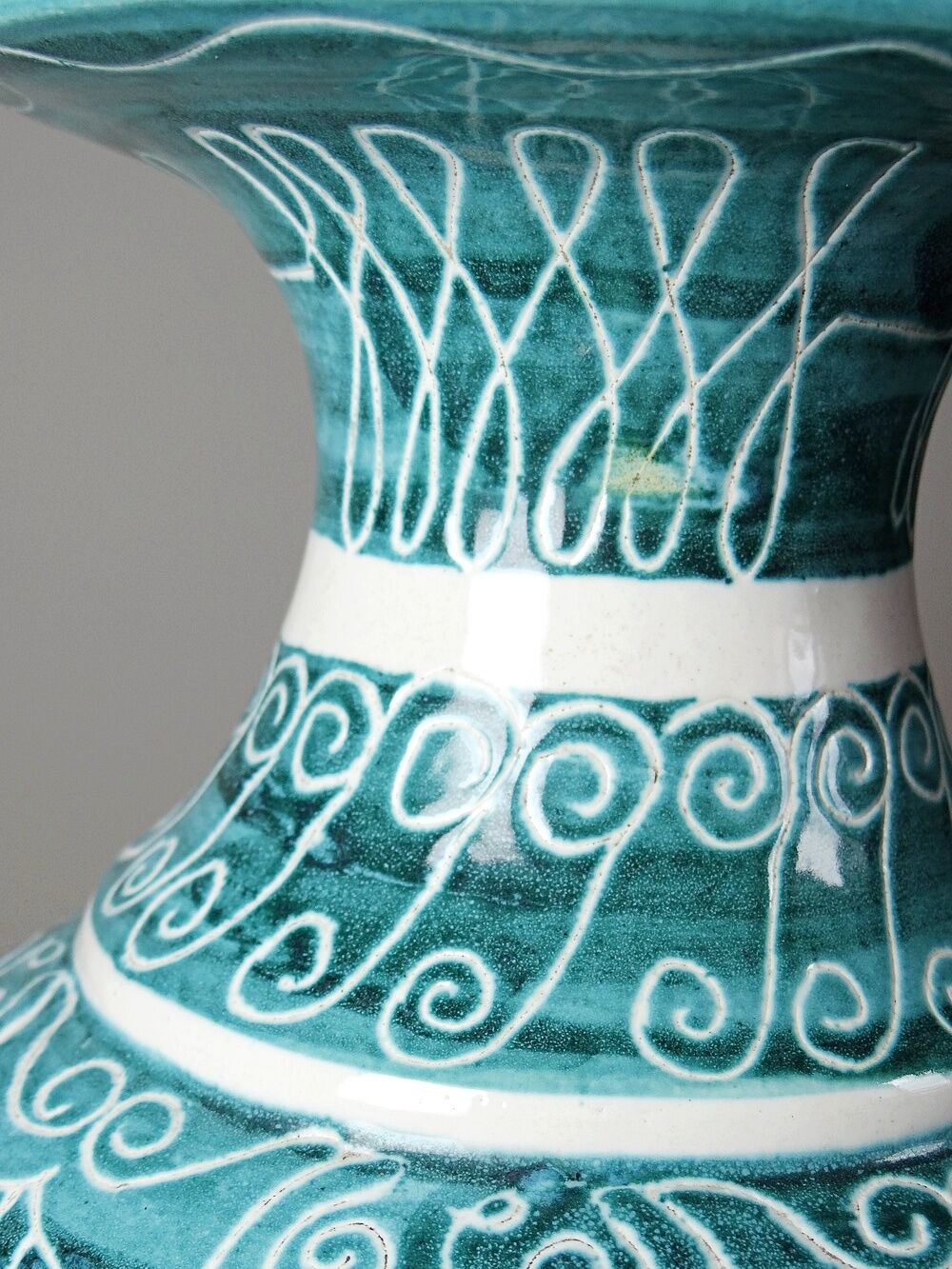 Vintage turquoise ceramic baluster vase with incised decoration.