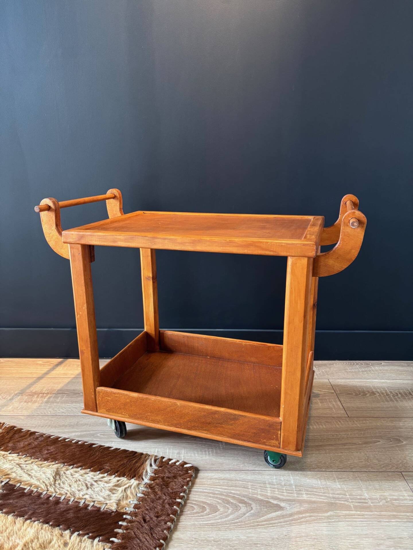 Vintage wooden trolley on wheels