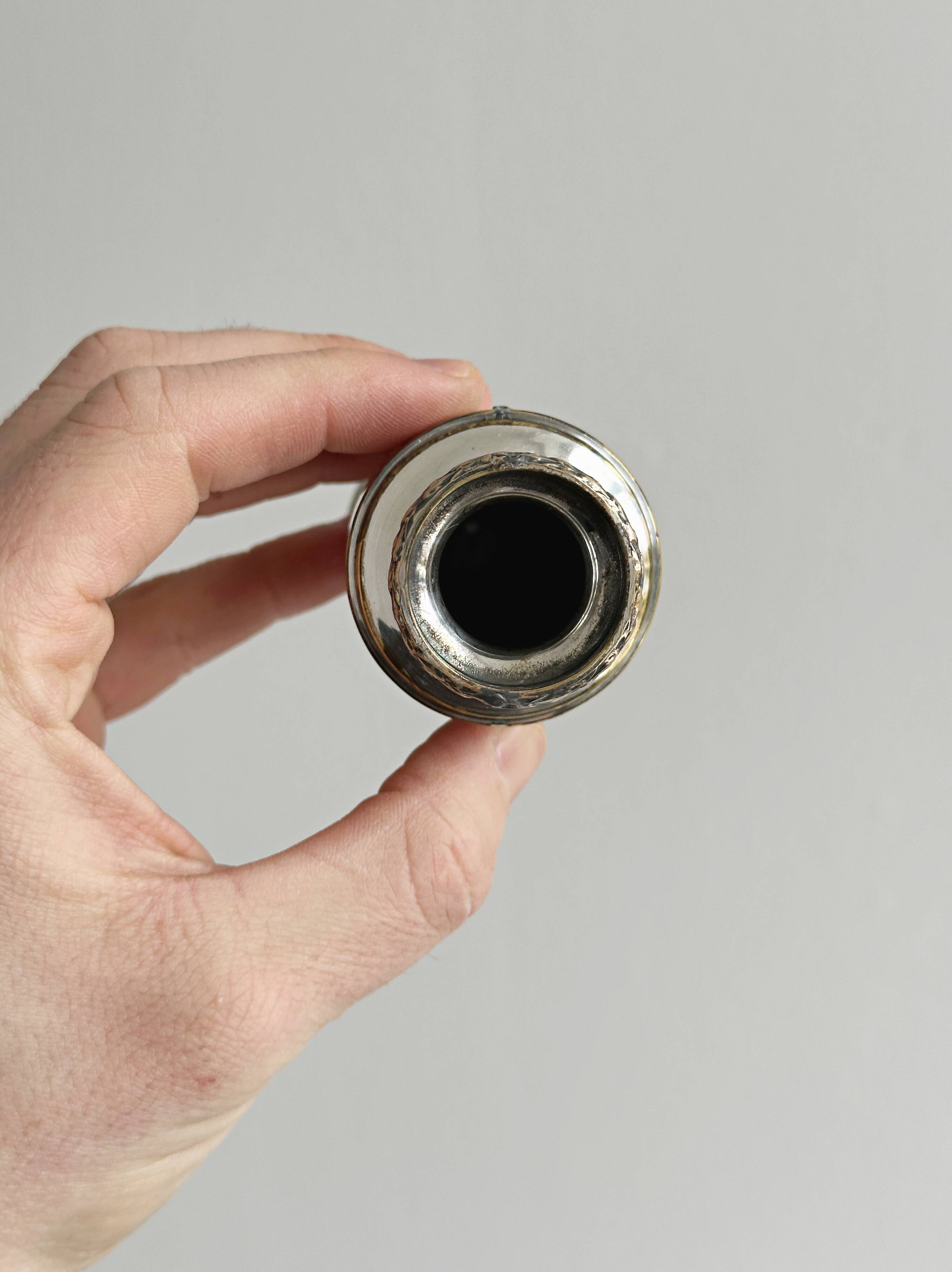 Small soliflore vase in very light metal.
