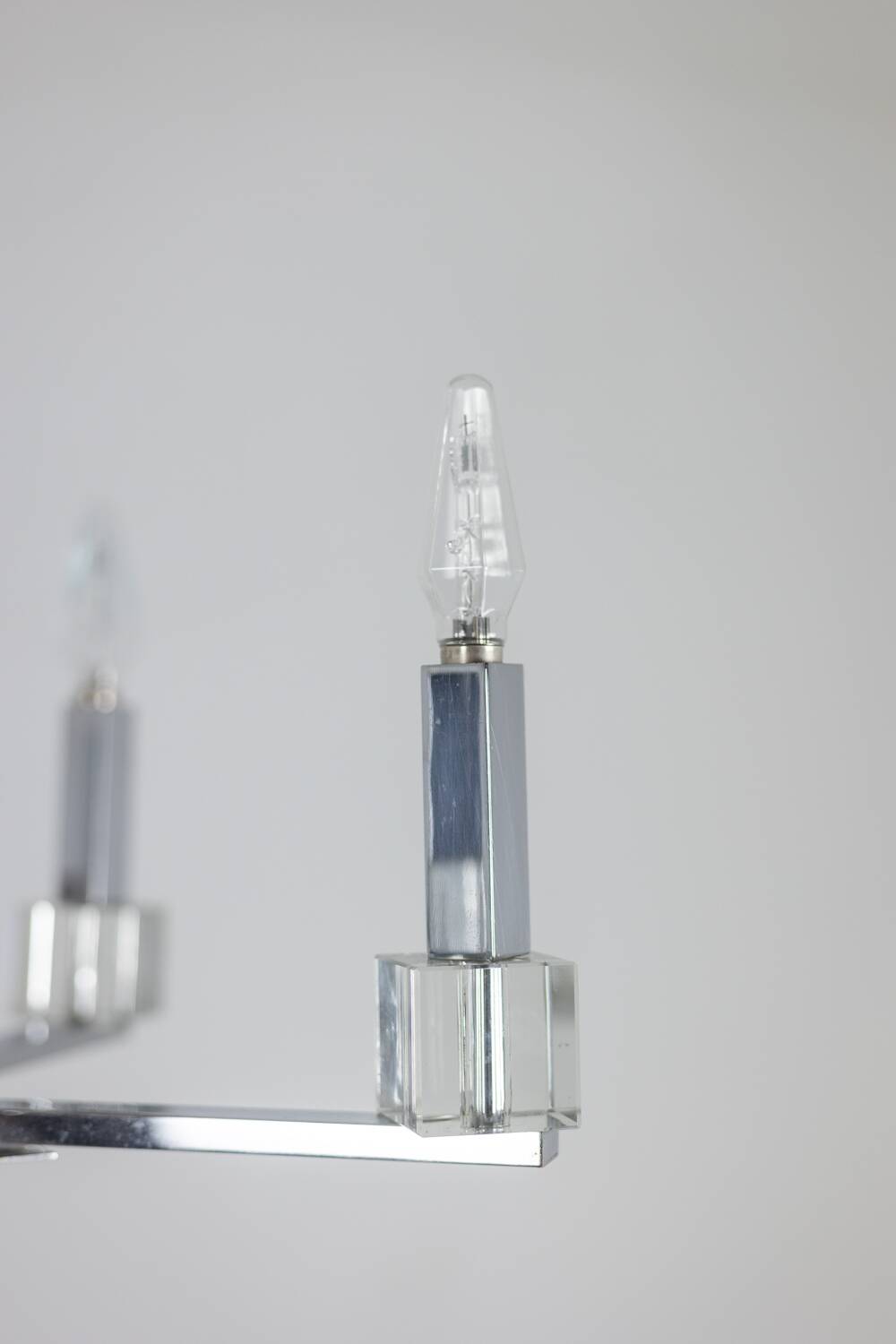 Jacques Adnet. Modernist chandelier in chromed metal. Circa 1940.