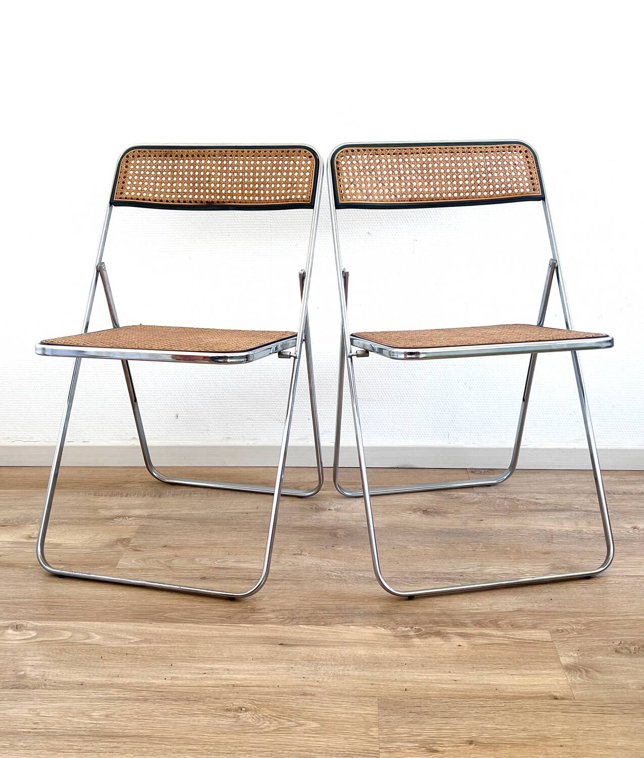 Pair of folding cane chairs