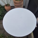 Round white wrought iron garden table