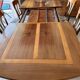 Extendable table in cherry wood with wrought iron legs.