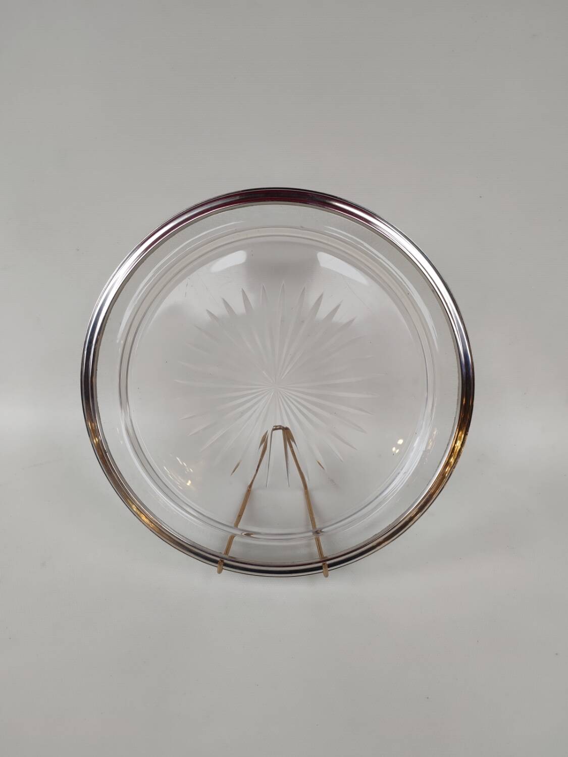 Cut crystal tray and solid silver rim.