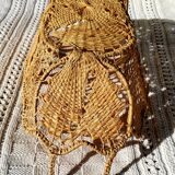Wicker and dented metal panière