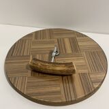 Vintage round wooden cheese board covered with glass plate with foldable handle