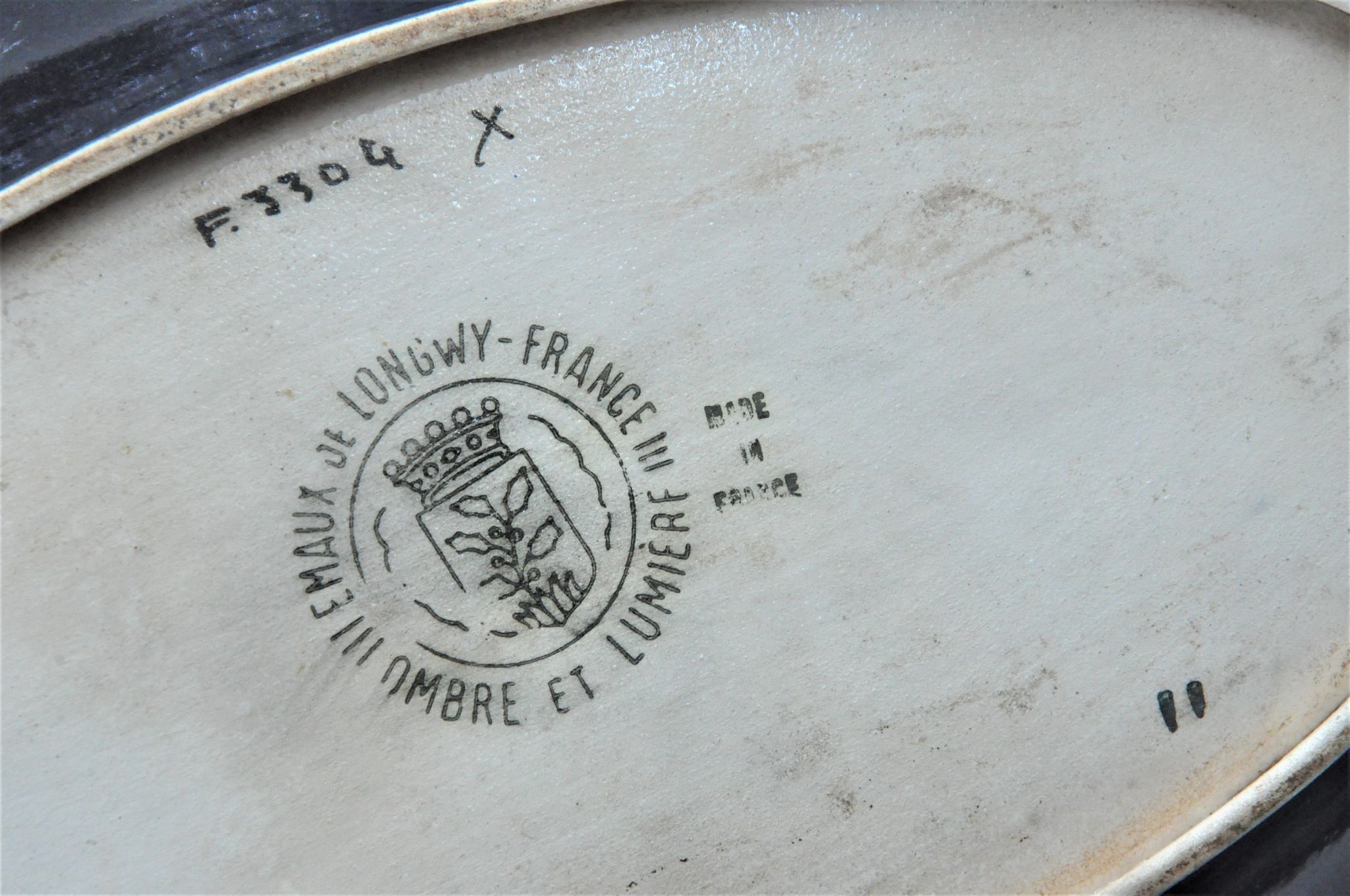 Old dish in enamels from longwy ombre et lumière collection ceramic design