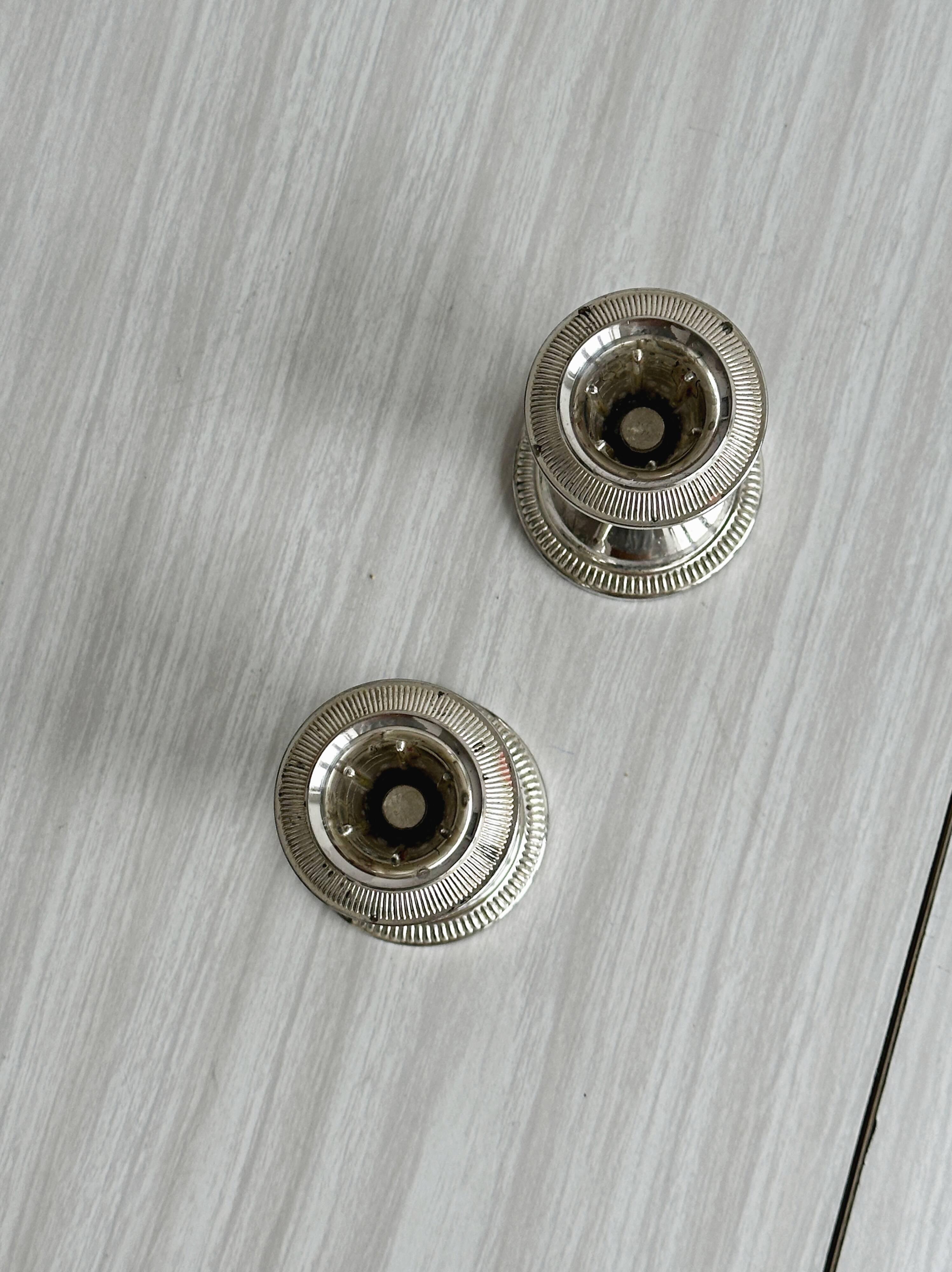 Set of 2 vintage silver-plated metal candle holders.