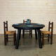 Brutalist round table in burnt wood yakisugi