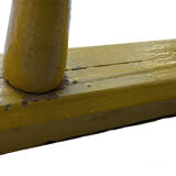 Old yellow wall coat rack