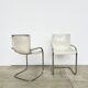 Pair of white moulded shell chairs with chrome tube — Space Age 70s
