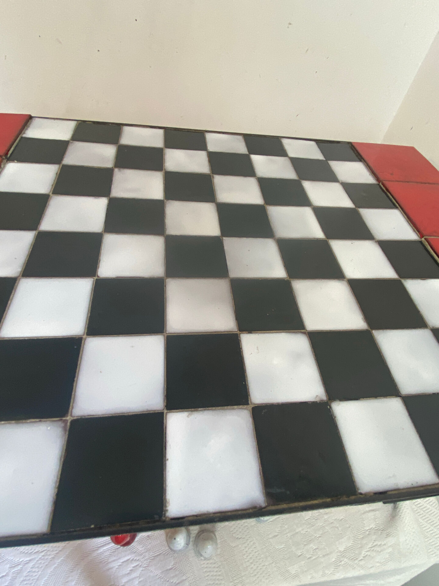 Chess set with ceramic board and pieces.
