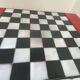 Chess set with ceramic board and pieces.