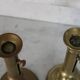 Pair of brass pusher candlesticks