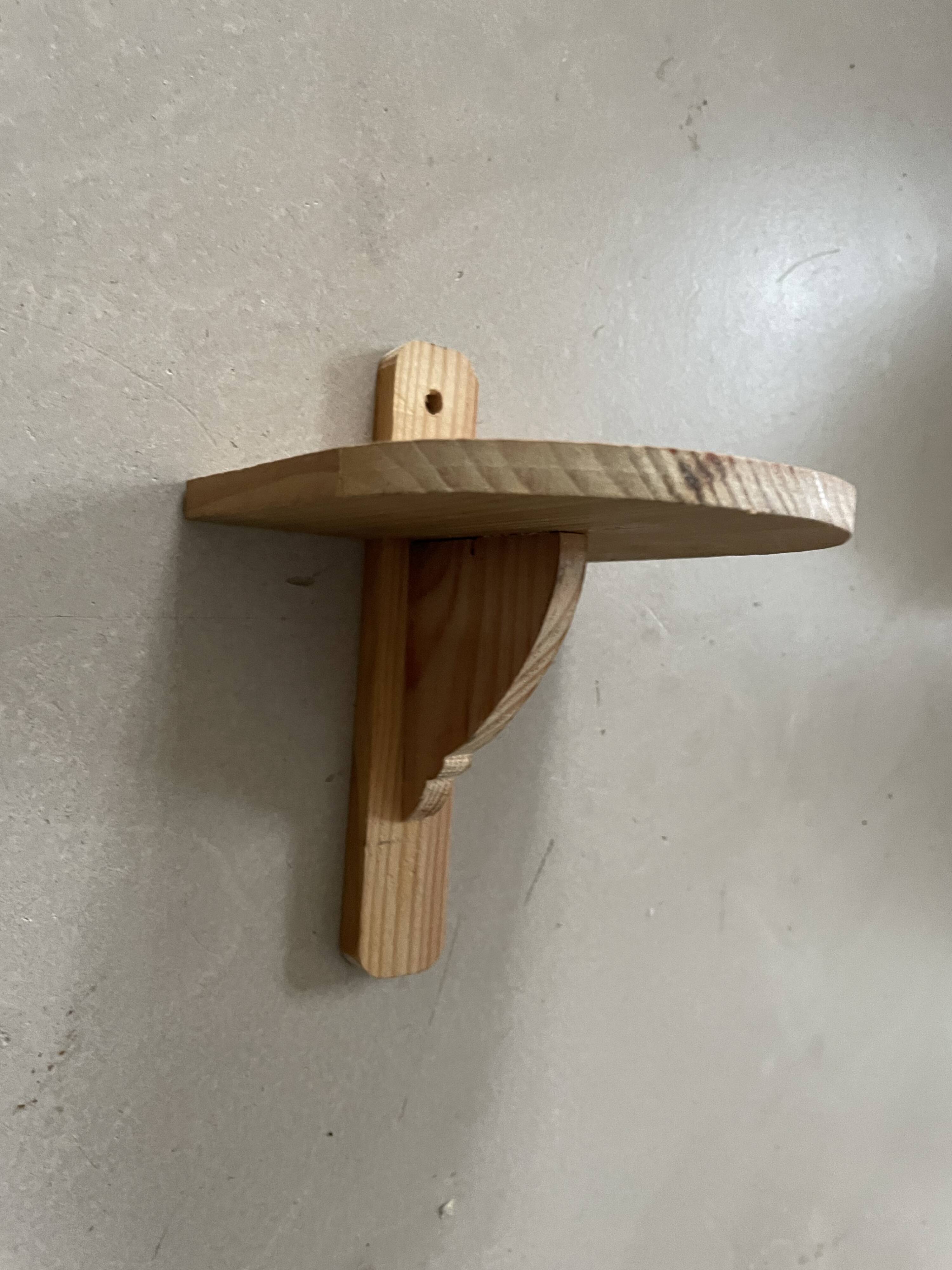 Small wall-mounted wooden shelf