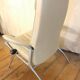 Beige leather armchair and footstool
