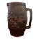 Hungarian folk ceramic pitcher with a brown glossy finish and relief decoration of vine.