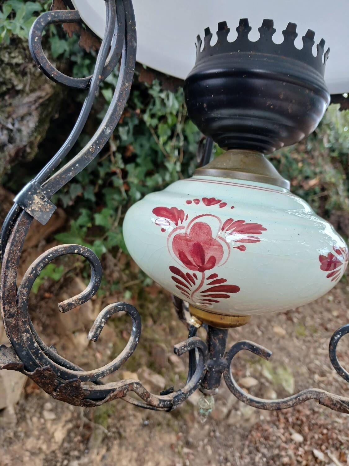 Antique wrought iron, glass and earthenware chandelier