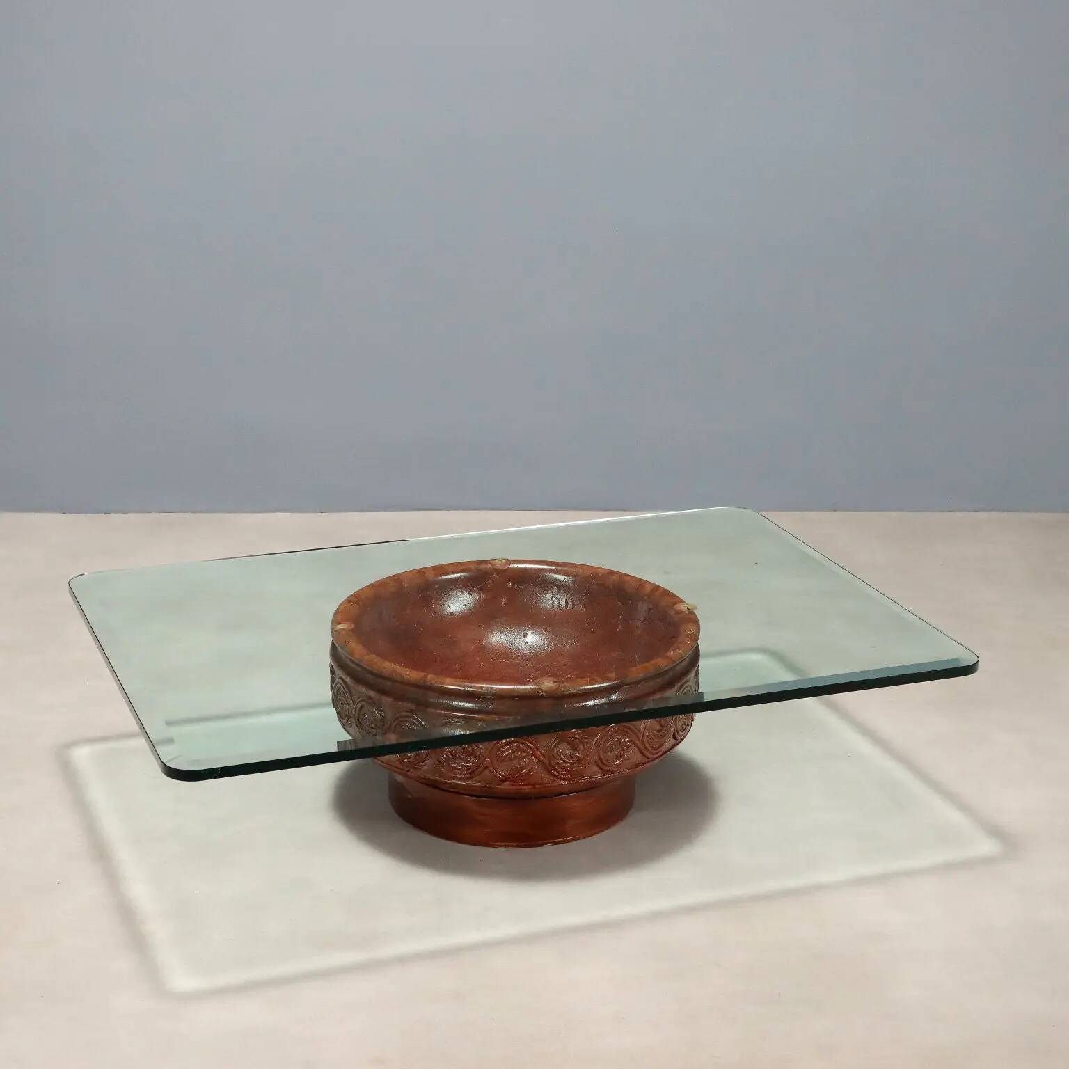 Vintage coffee table with a glass top and a terracotta base, 20th century.