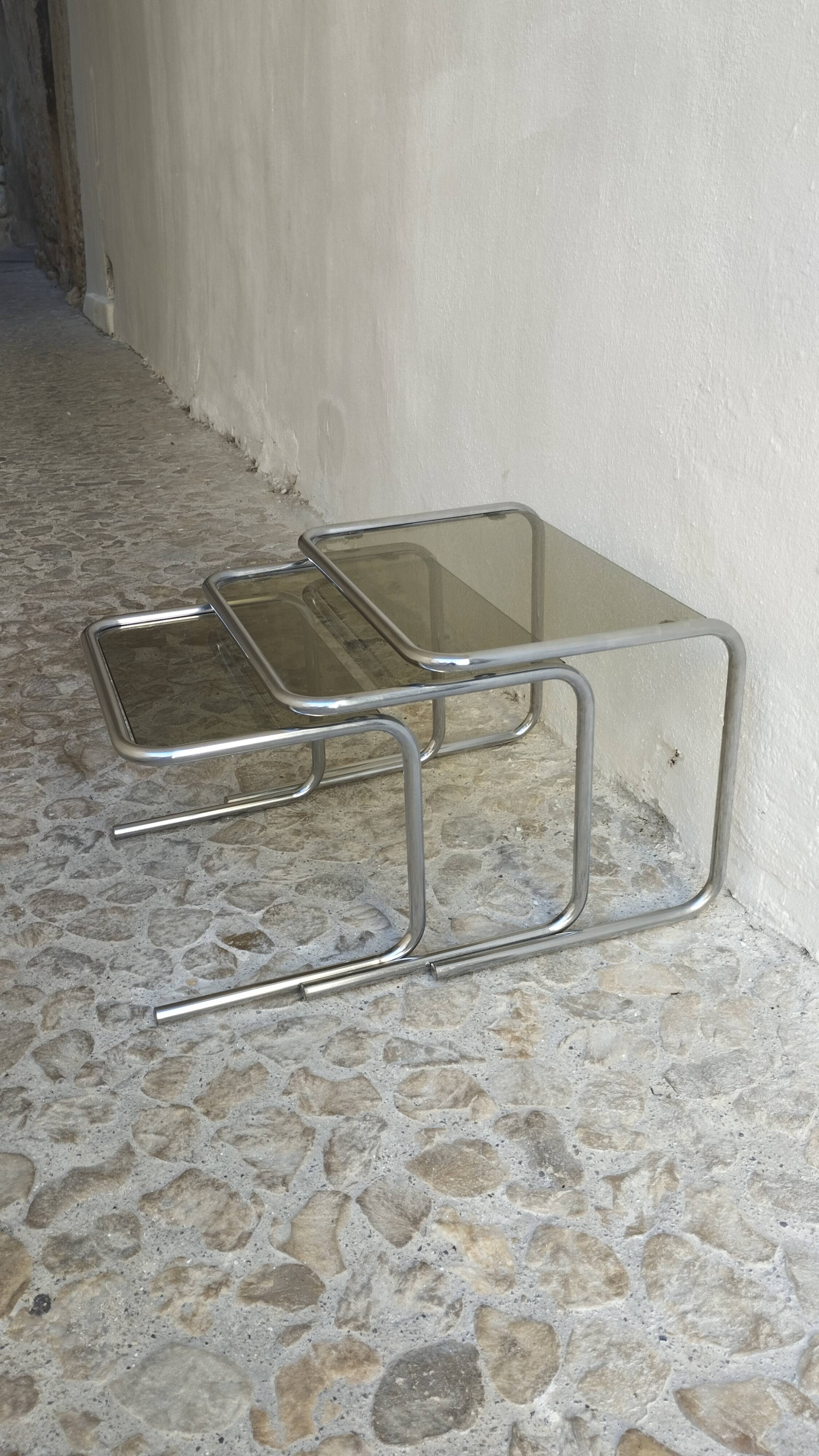 Nesting tables in chrome and smoked glass from the 70s