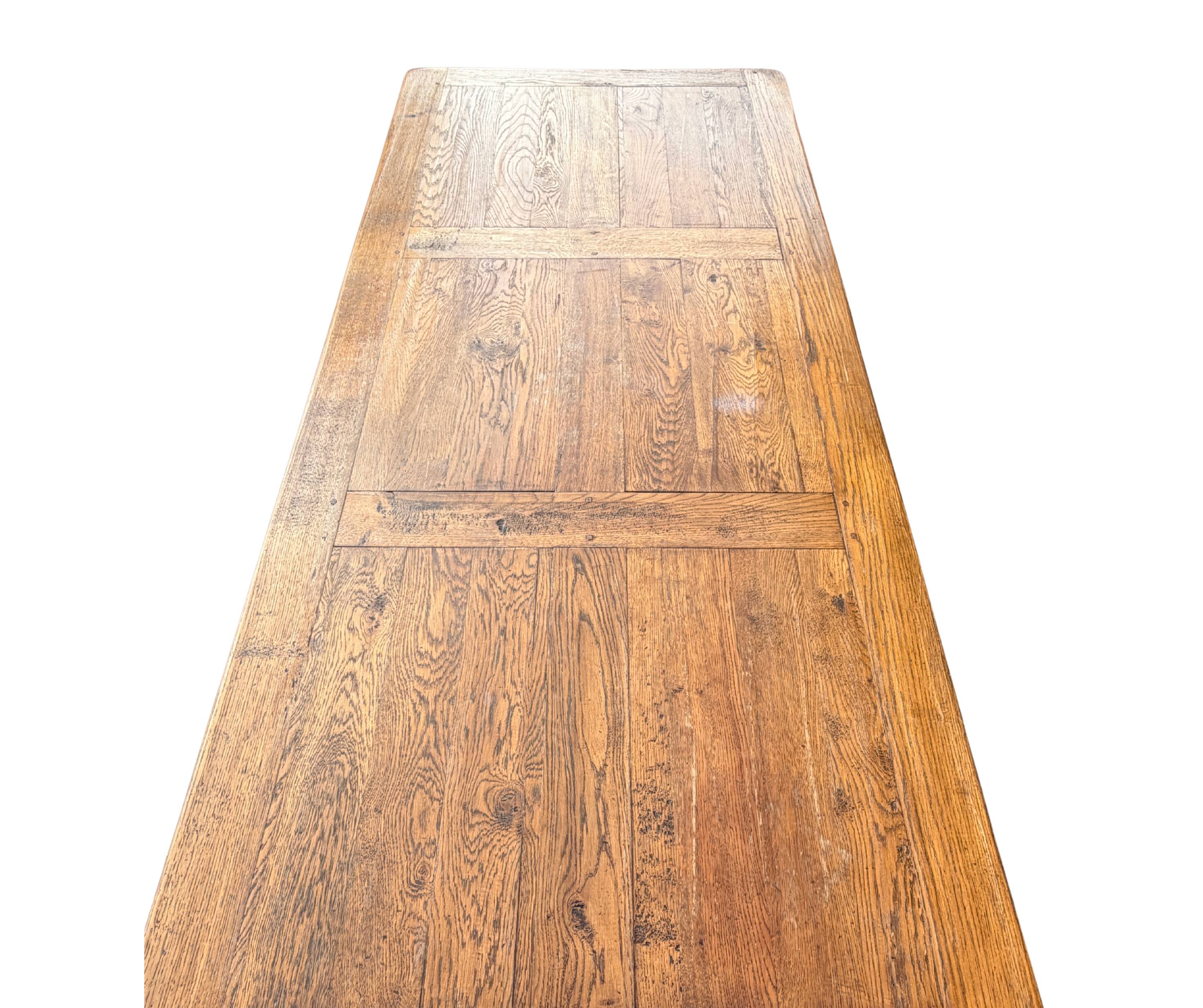 Large farmhouse table made of solid wood.