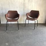 Set of 2 mid-century brown faux leather armchairs with black metal legs, 1960s.