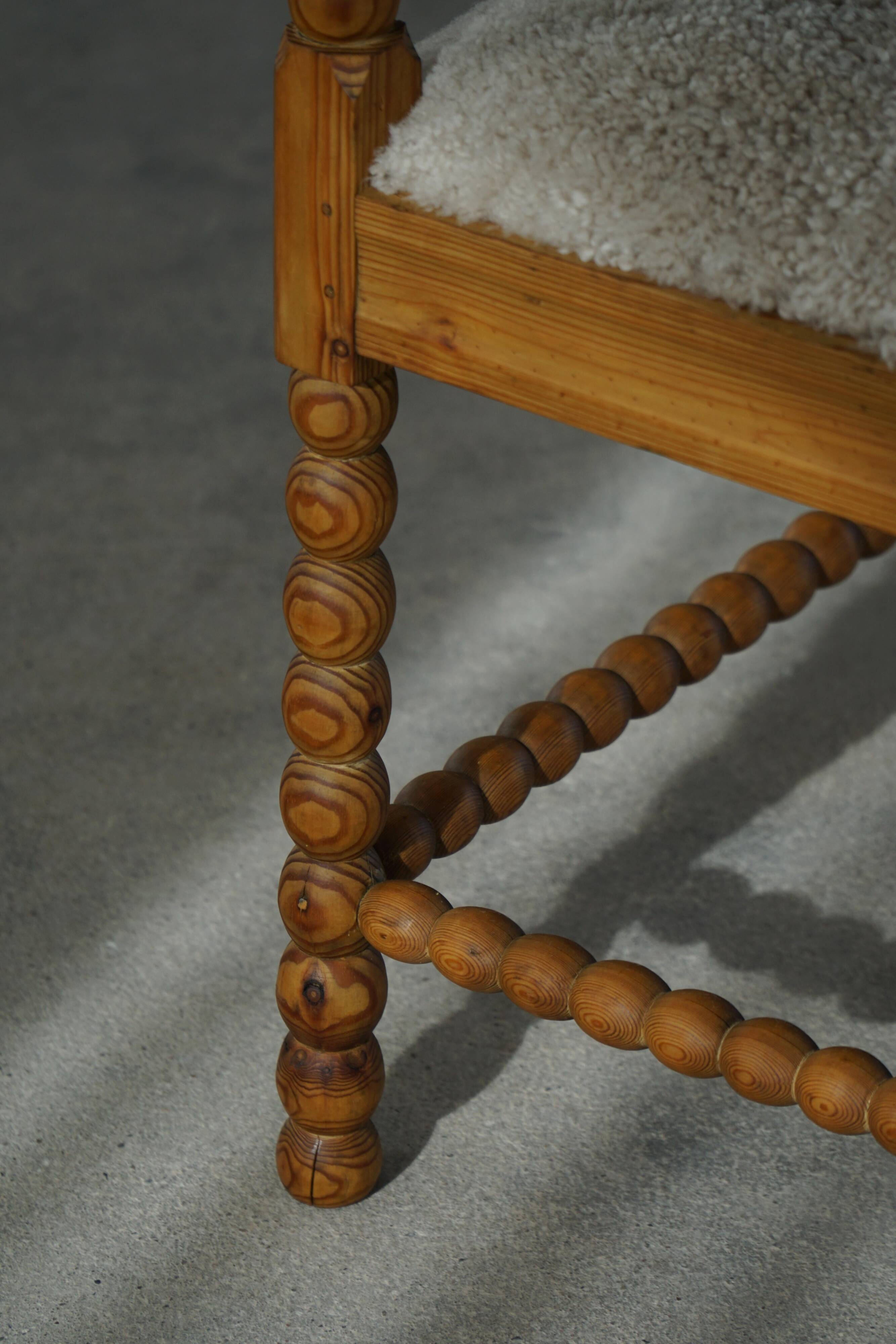 Antique French corner chair handcrafted with lamb's wool, early 20th century.