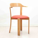 Chair upholstered in red and beech