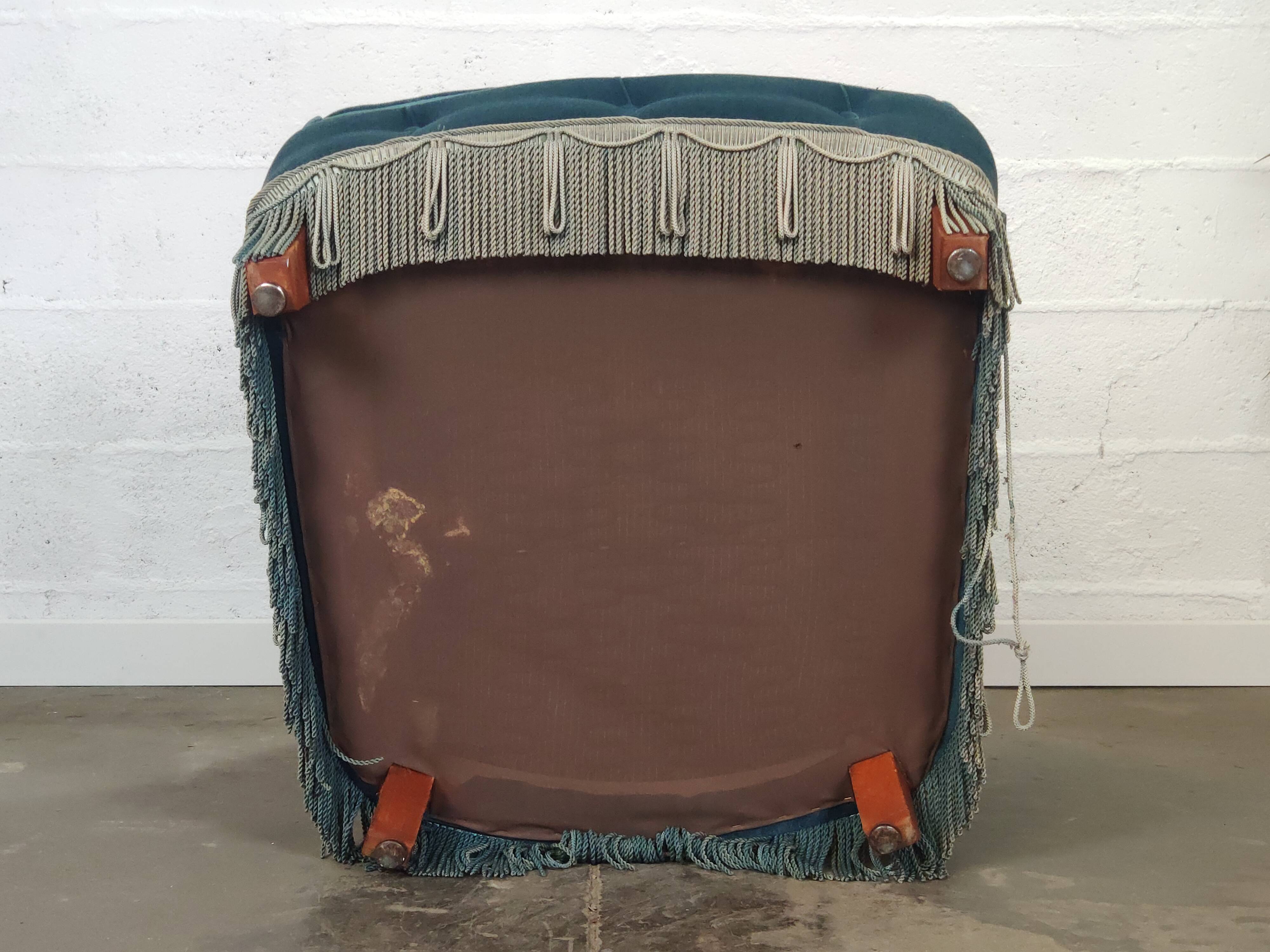 Pair of blue velvet armchairs with fringes