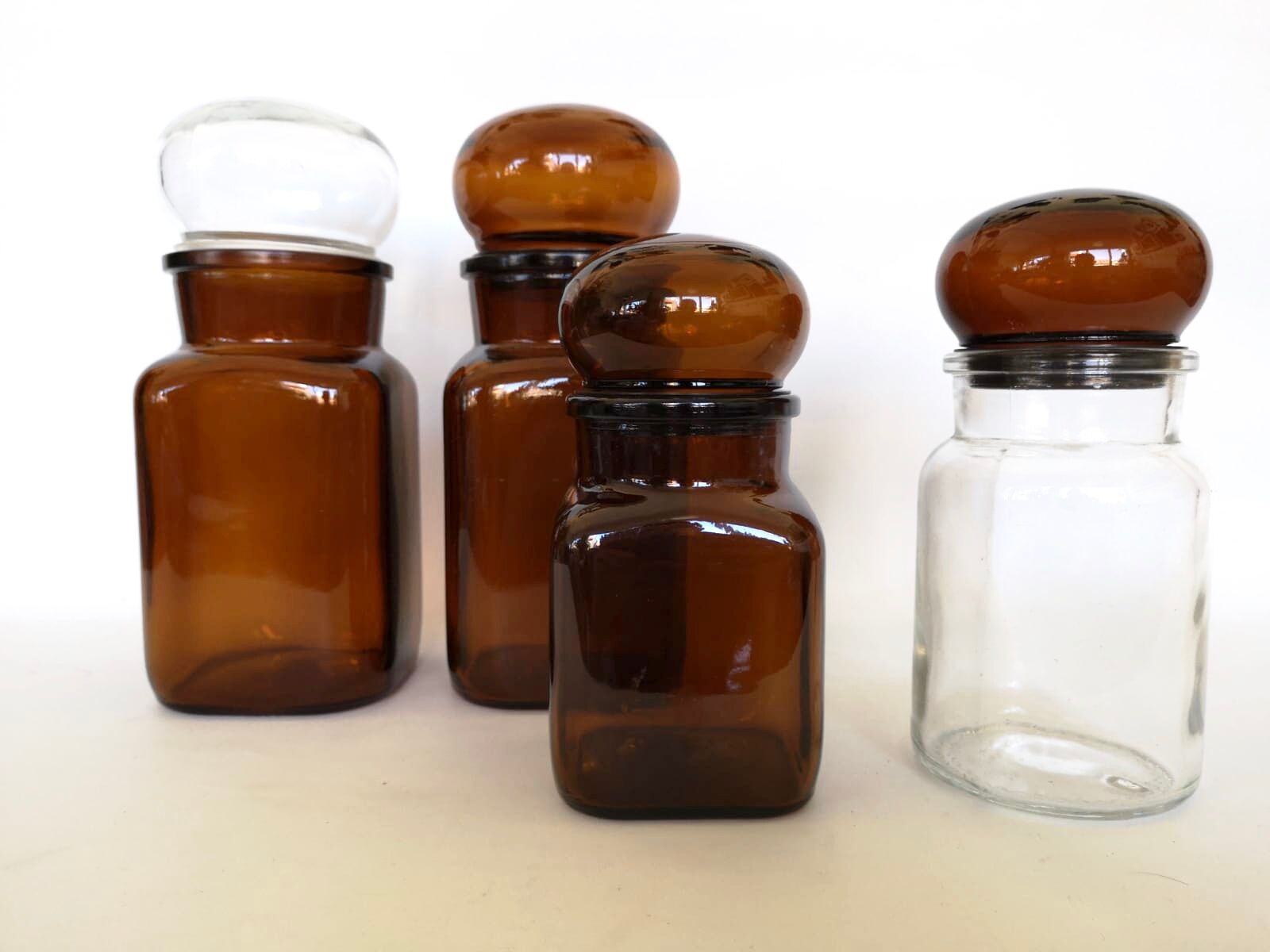 Set of 4 clear and brown glass jars