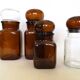 Set of 4 clear and brown glass jars