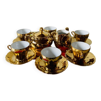 Old tea or coffee service in gilded porcelain