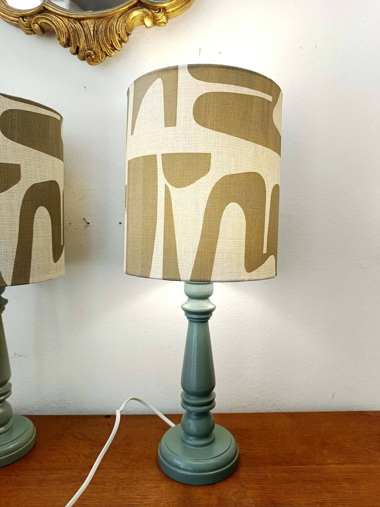 Pair of wooden lamps with custom modernist lampshades.