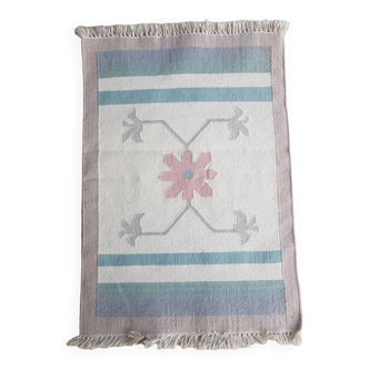 Ethnic bedside rug in pastel tones