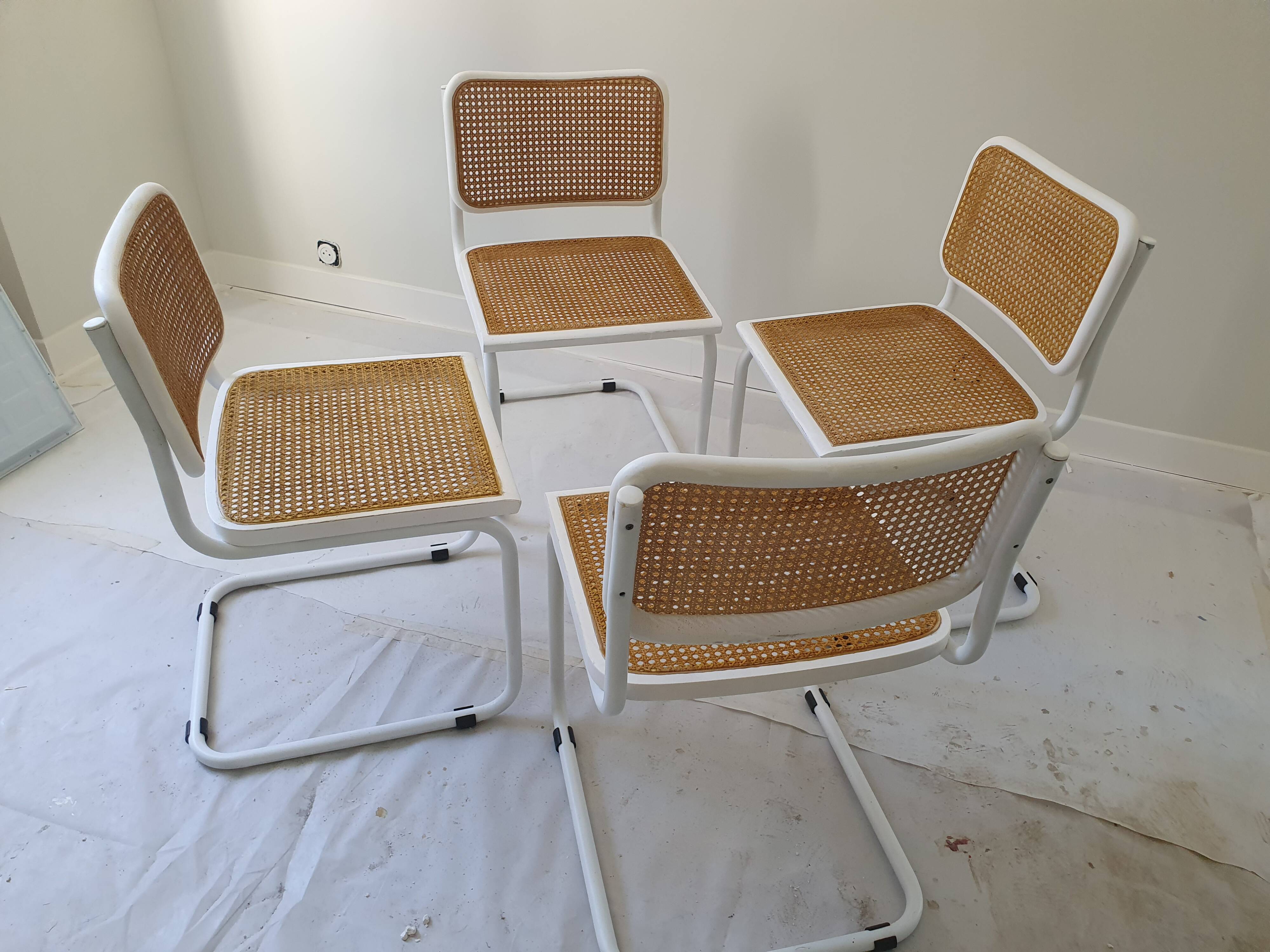 B32 chairs by Marcel Breuer in white.