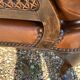 Paire de fauteuils en cuir joues en cannage