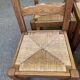 6 solid oak chairs with rush seats in a country style.