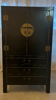 Asian-inspired black lacquered wooden wardrobe