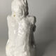 White ceramic seated sculpture