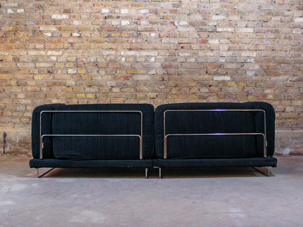 Black fabric design sofa with chromed steel frame