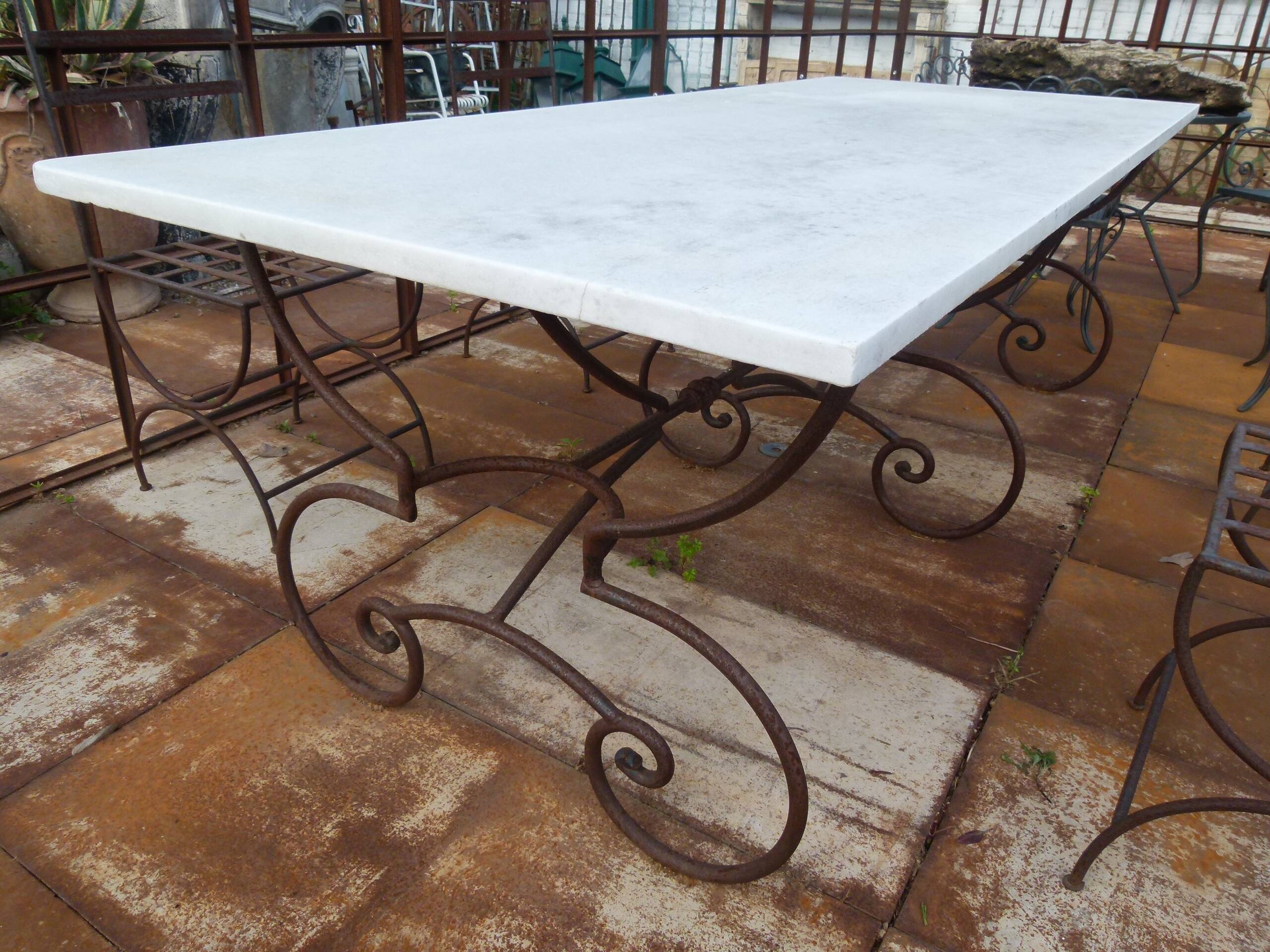 Marble table with wrought iron legs